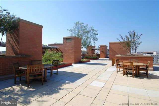 a spacious bathroom with a sink and a mirror