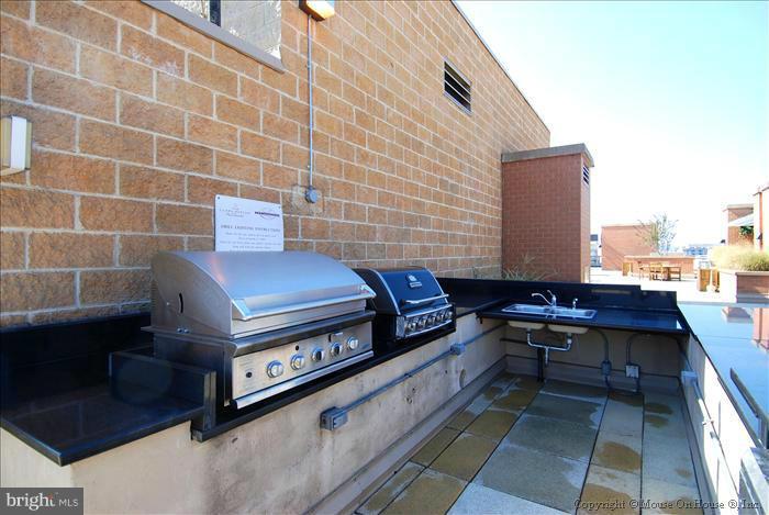 616 E Street Northwest, Unit 1207 Washington, DC 20004 - Photo 21 of 25 a view of a terrace with outdoor seating