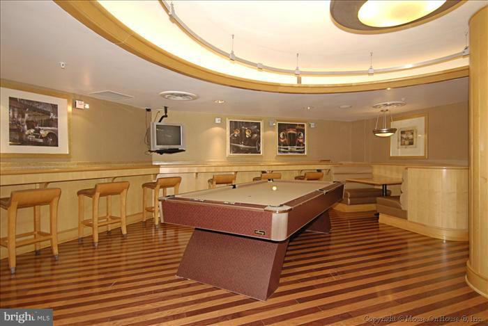 616 E Street Northwest, Unit 1207 Washington, DC 20004 - Photo 23 of 25 a spacious bathroom with a sink and a mirror