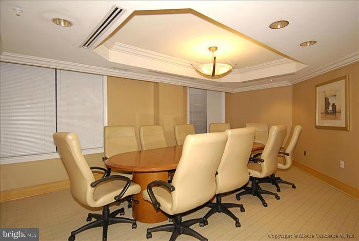 616 E Street Northwest, Unit 1207 Washington, DC 20004 - Photo 24 of 25 a view of a dining room with furniture and wooden floor