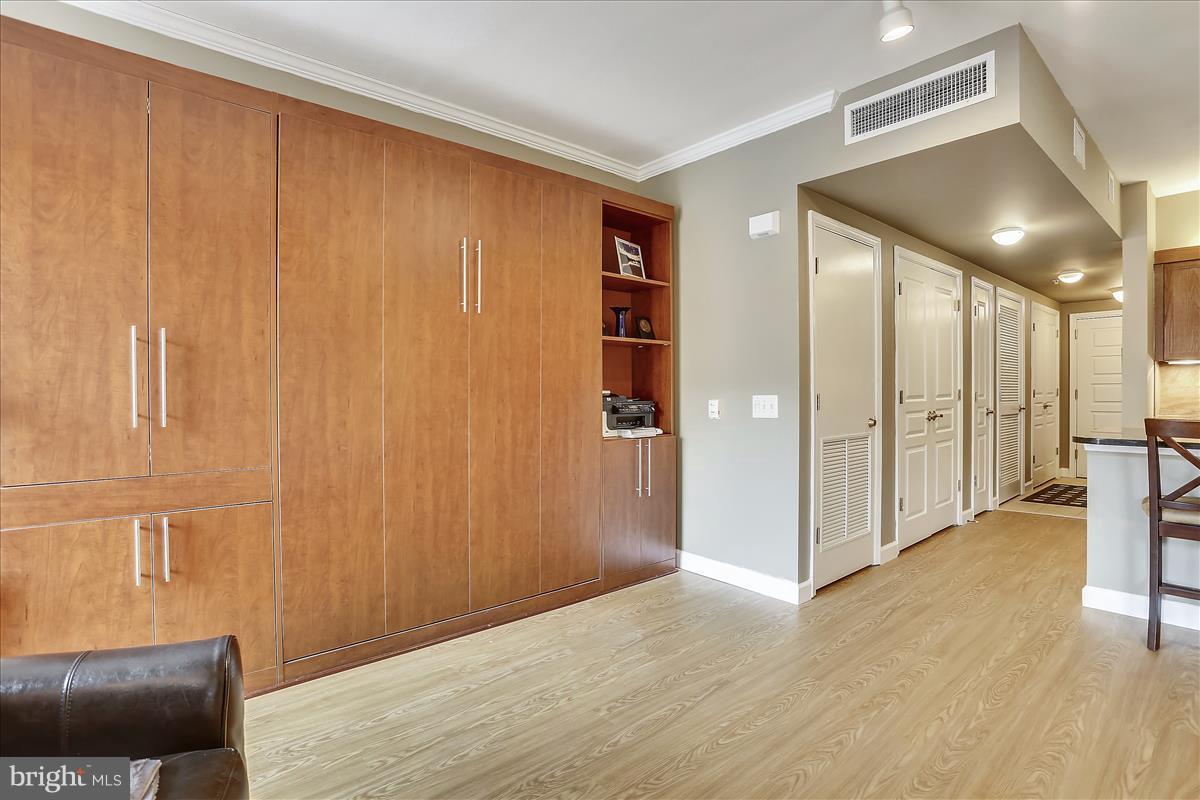 616 E Street Northwest, Unit 1207 Washington, DC 20004 - Photo 10 of 25 a view of livingroom with furniture and wooden floor
