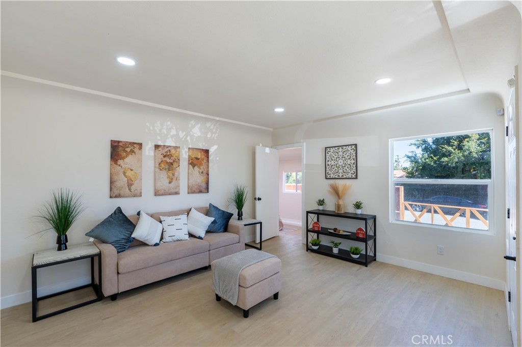 911 West George Street Banning, CA 92220 - Photo 11 of 32 a bedroom with furniture and a window