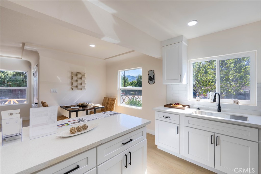 911 West George Street Banning, CA 92220 - Photo 15 of 32 a kitchen with a sink cabinets and window