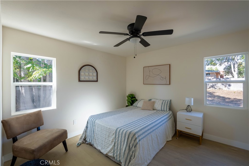 911 West George Street Banning, CA 92220 - Photo 22 of 32 a bedroom with a bed and furniture