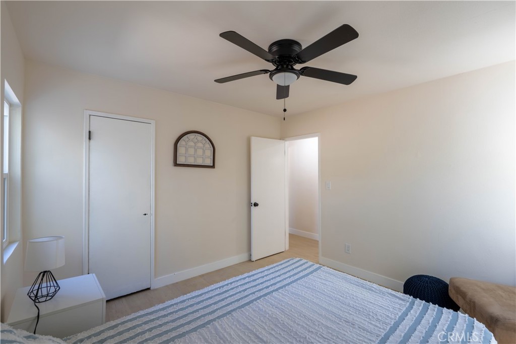 911 West George Street Banning, CA 92220 - Photo 23 of 32 wooden floor in an empty room with a window