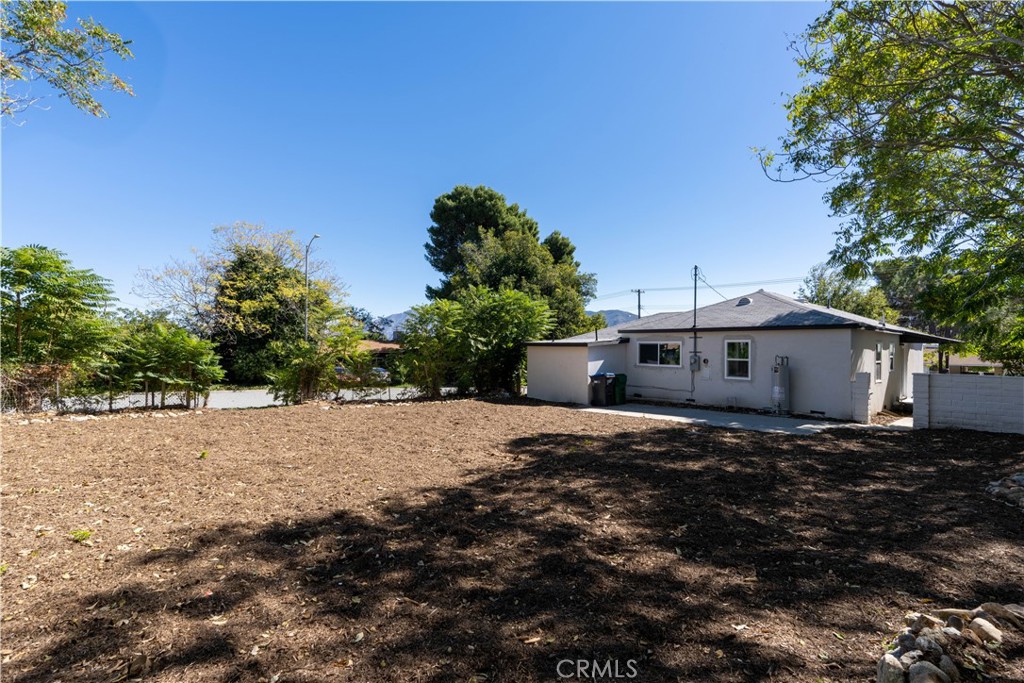 911 West George Street Banning, CA 92220 - Photo 32 of 32 a big house with a big yard plants and large trees