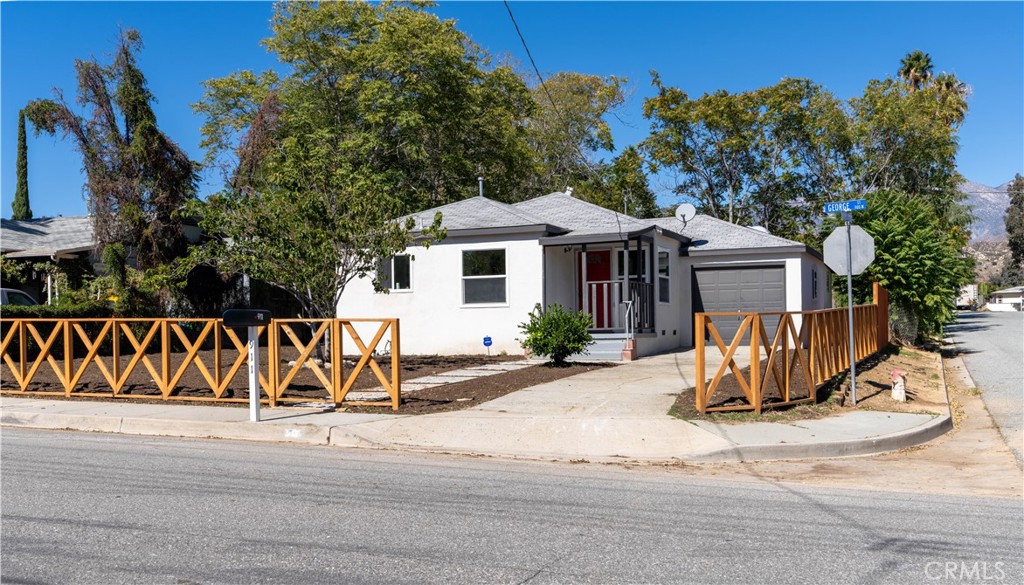 911 West George Street Banning, CA 92220 - Photo 5 of 32 a view of a house with a yard and sitting area