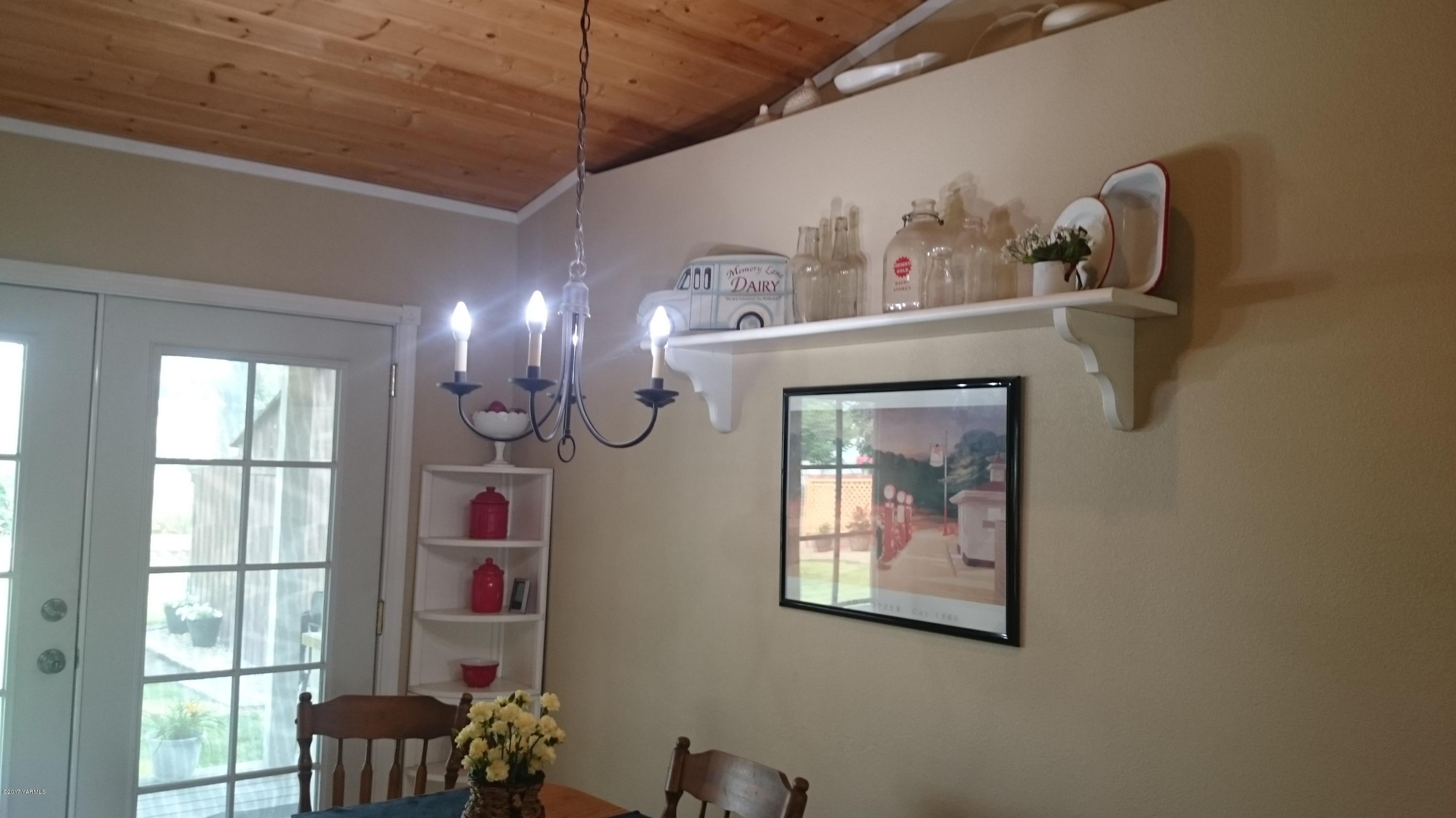 2817 Wiley Road Yakima, WA 98903 - Photo 22 of 27 a view of a dining room with furniture and chandelier