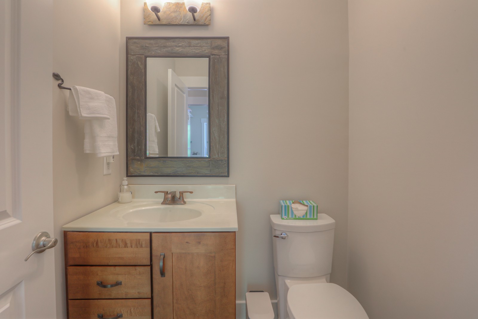 1115 Ridgecrest Road Kingston Springs, TN 37082 - Photo 25 of 38 a bathroom with a toilet sink and mirror