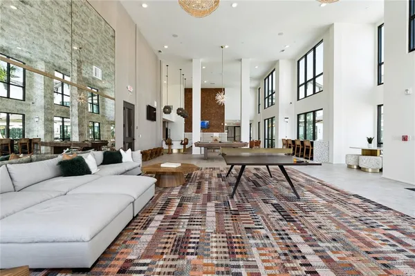 a living room with furniture and a rug