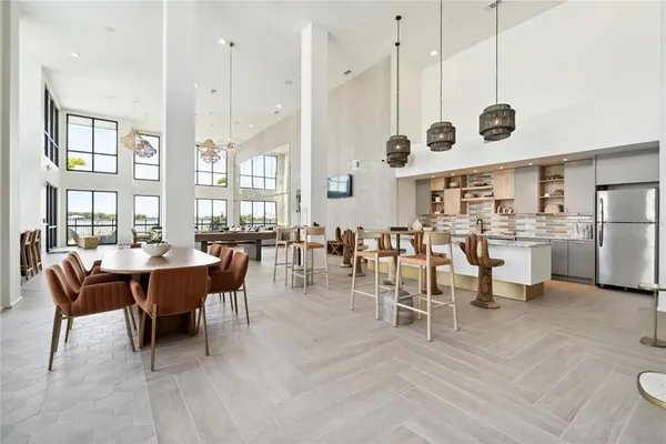 a large kitchen with a table and chairs