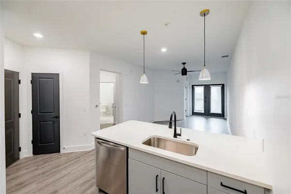 a kitchen with a sink and refrigerator
