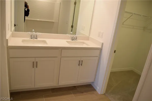 a bathroom with a sink and a mirror