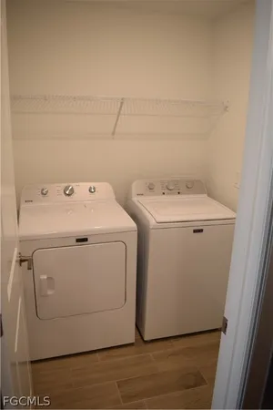 a utility room with dryer and washer