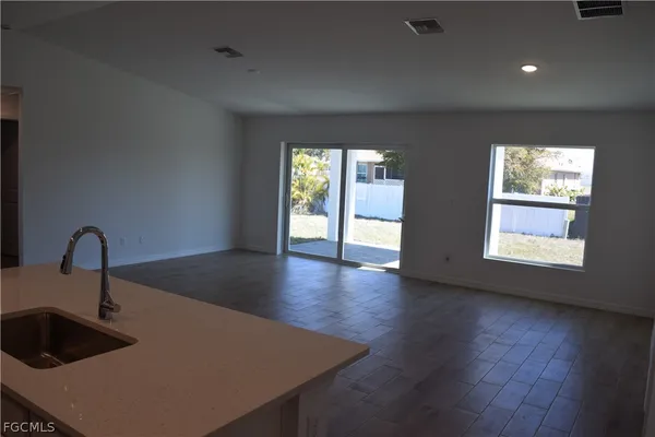 a kitchen with sink and window