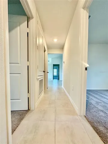 a bathroom with a granite countertop sink a toilet and bathtub