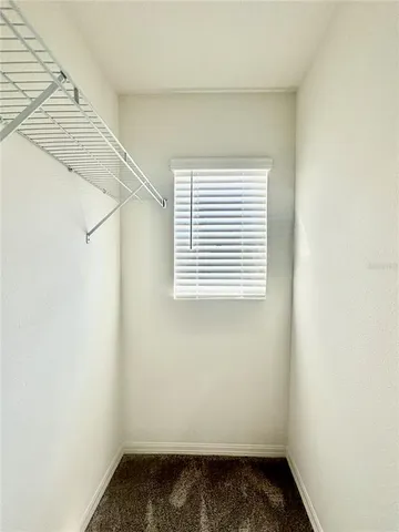 an empty room with a empty space and a window