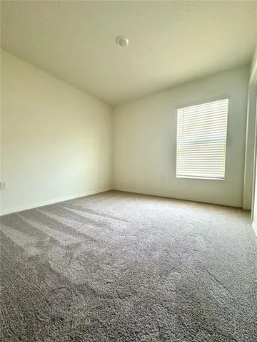 a view of storage and utility room with a fireplace