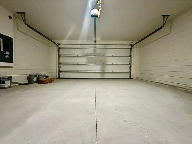 a view of a house with a swimming pool and a yard