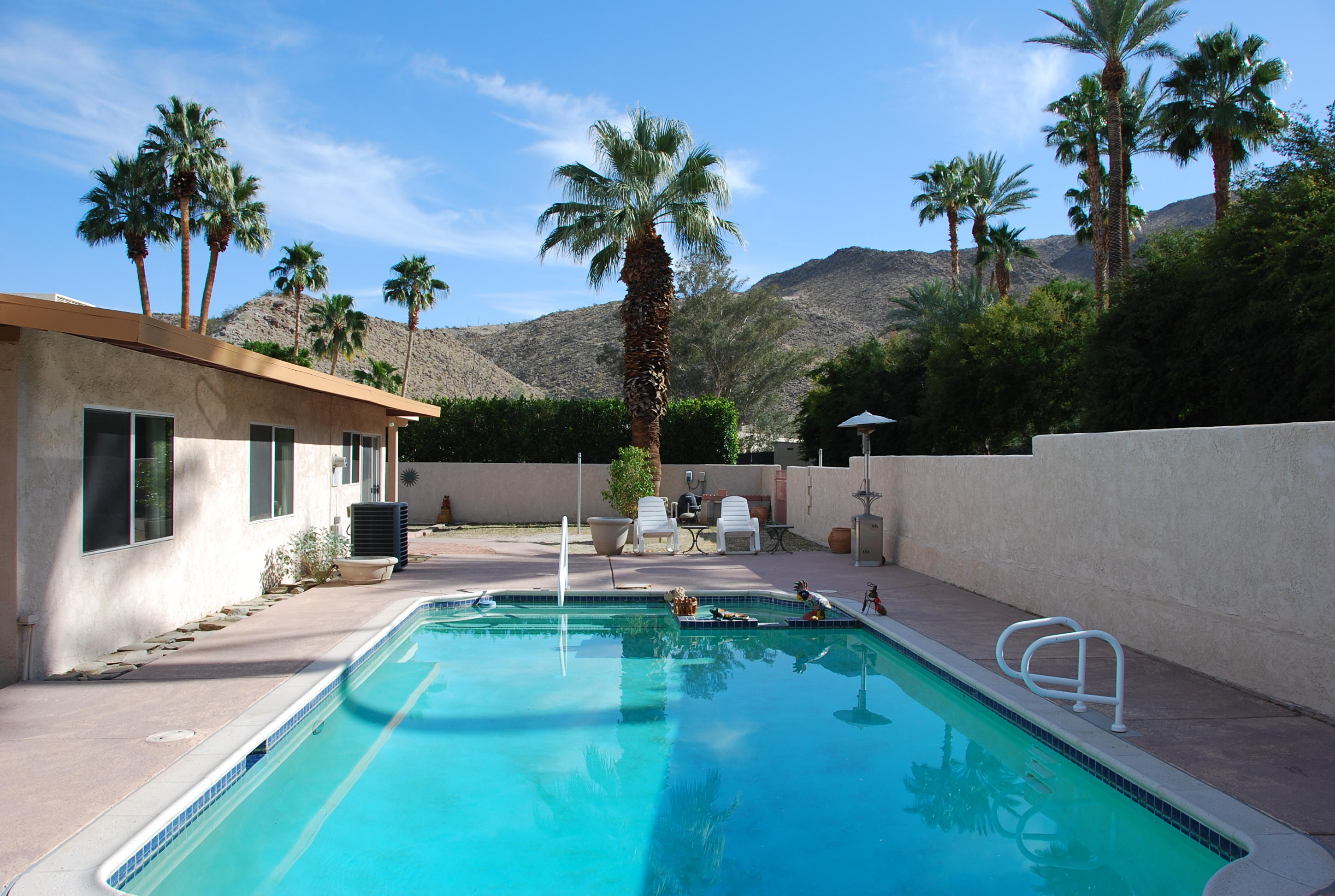 71601 Gardess Road Rancho Mirage, CA 92270 - Photo 12 of 17 a view of a patio with couches table and chairs and potted plants