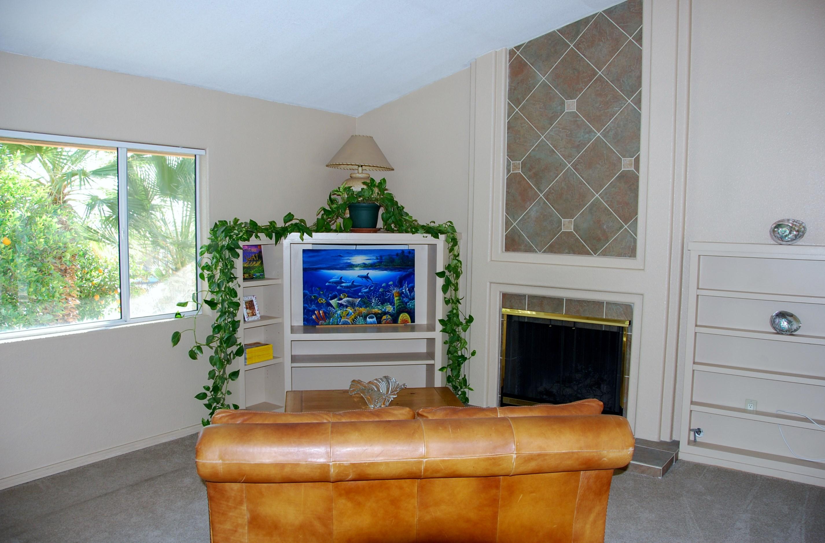 71601 Gardess Road Rancho Mirage, CA 92270 - Photo 4 of 17 a room with furniture and a fireplace