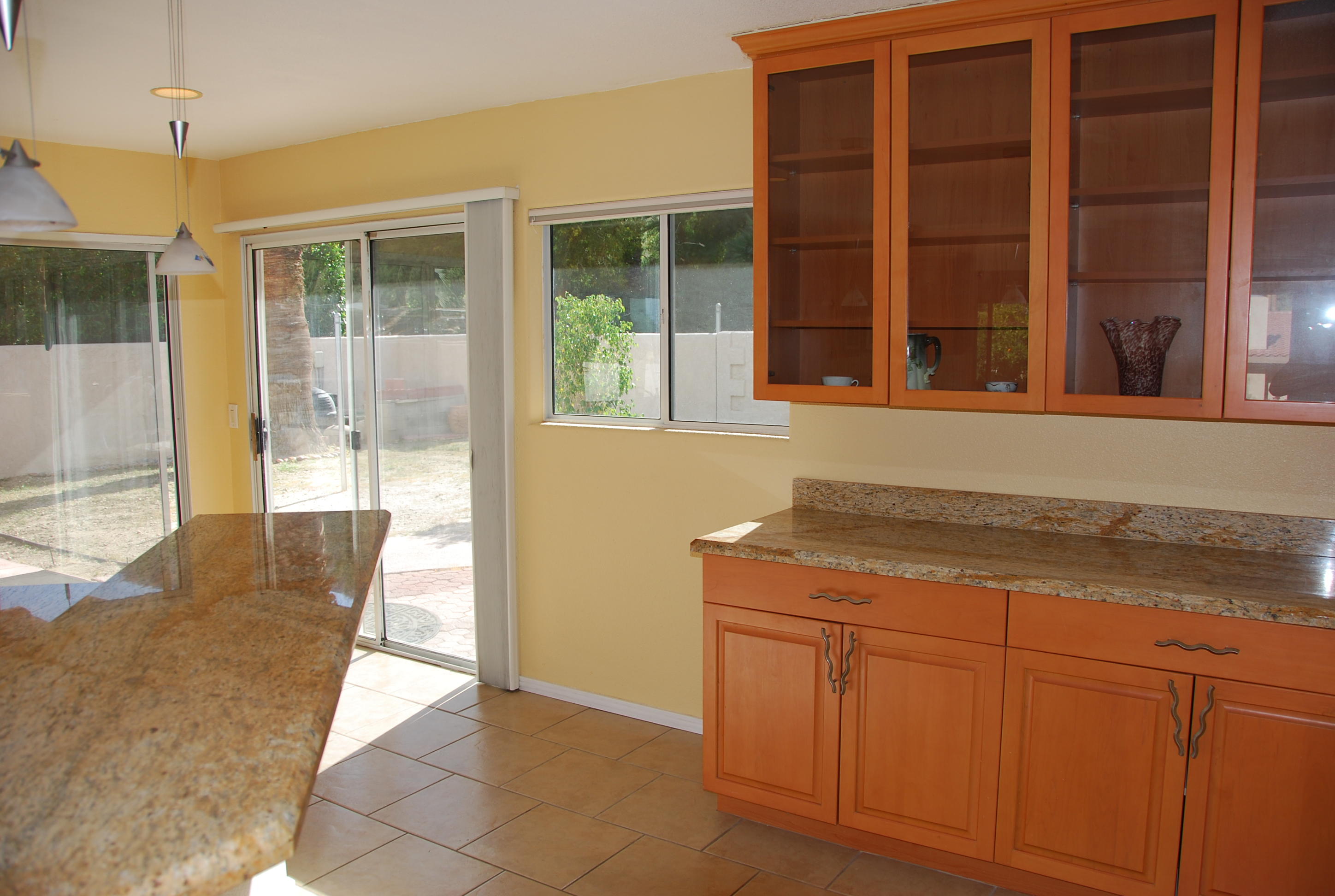 71601 Gardess Road Rancho Mirage, CA 92270 - Photo 6 of 17 a kitchen with granite countertop cabinets and wooden floor