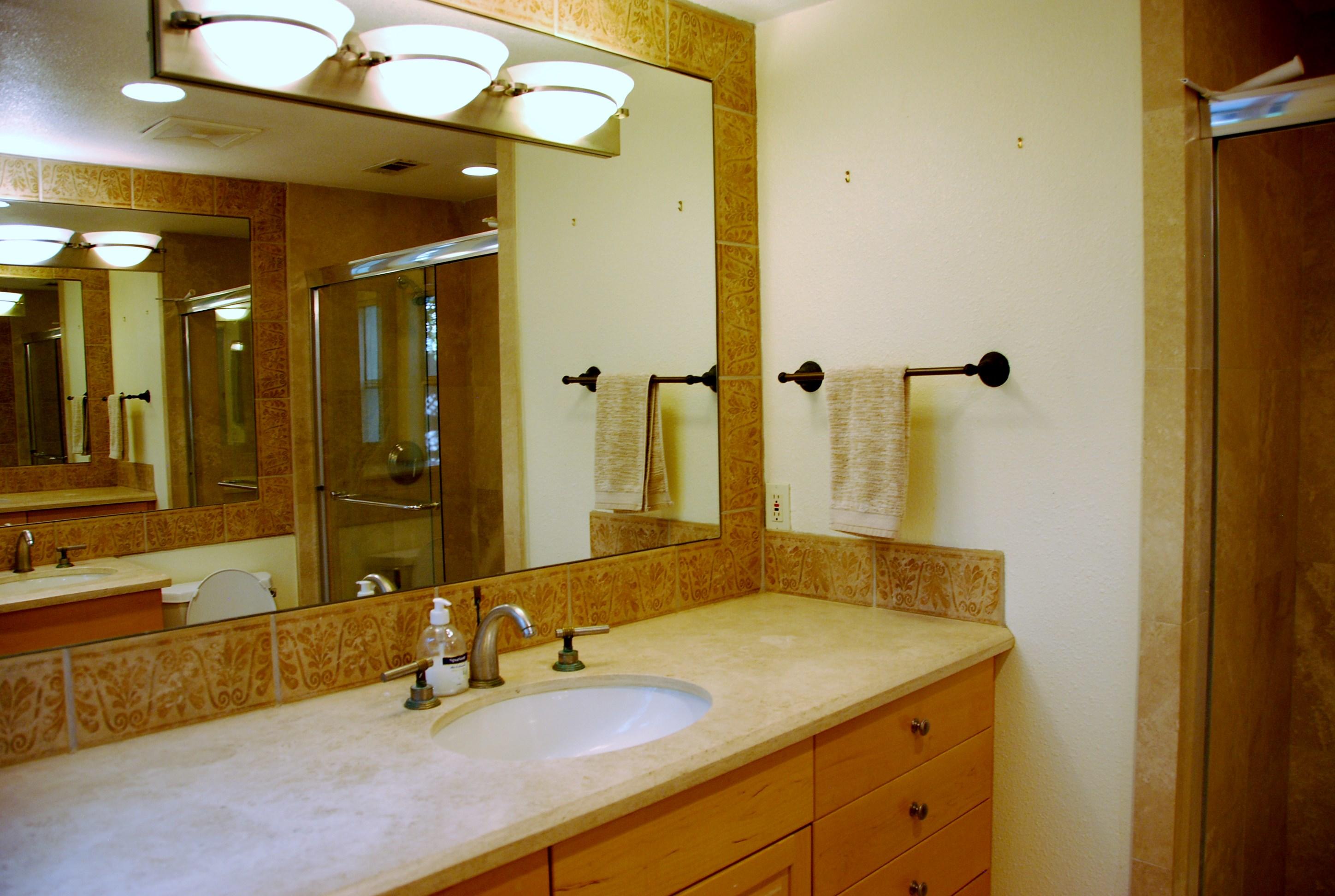 71601 Gardess Road Rancho Mirage, CA 92270 - Photo 9 of 17 a bathroom with a granite countertop sink and a mirror