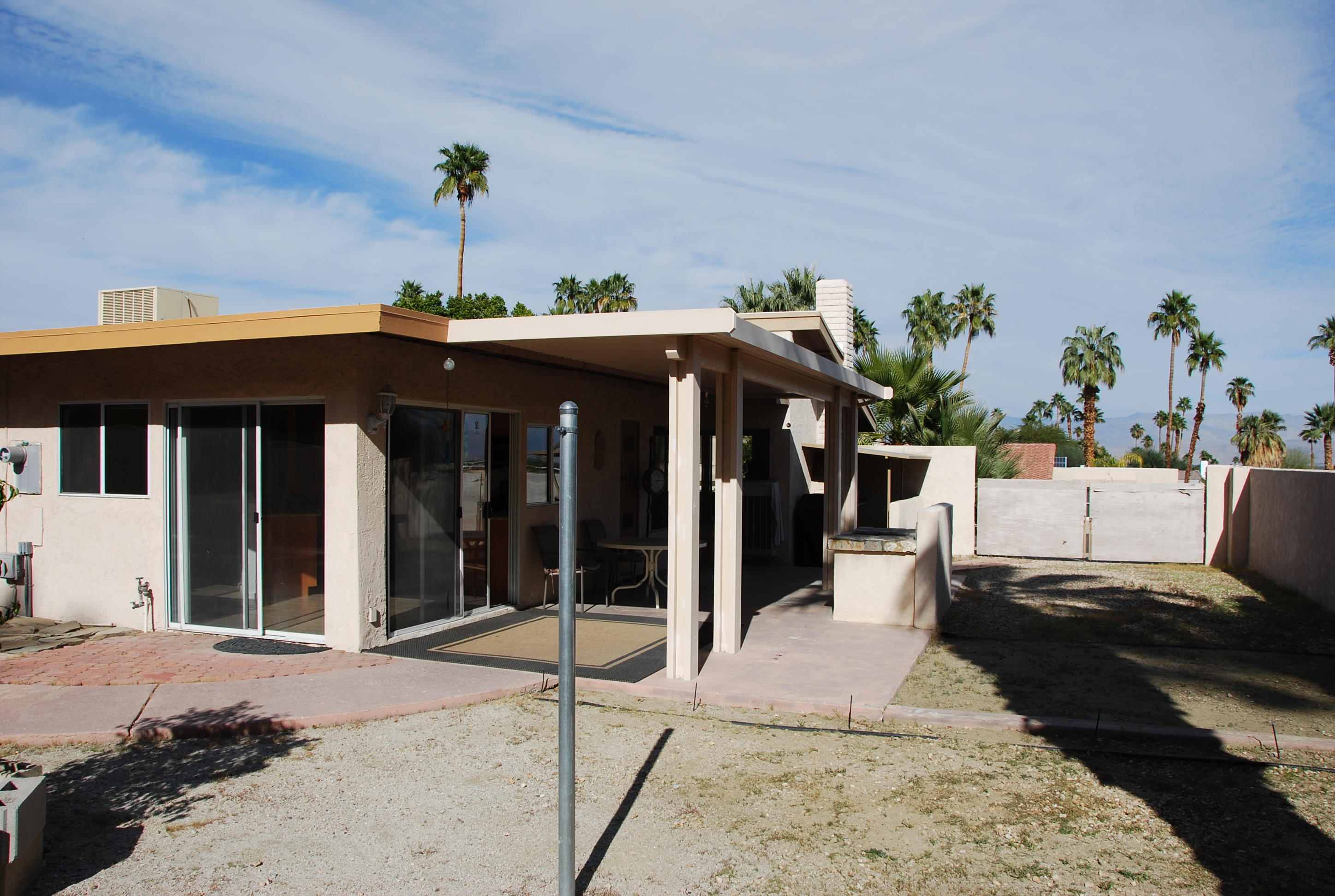 71601 Gardess Road Rancho Mirage, CA 92270 - Photo 10 of 17 a front view of a house with a porch
