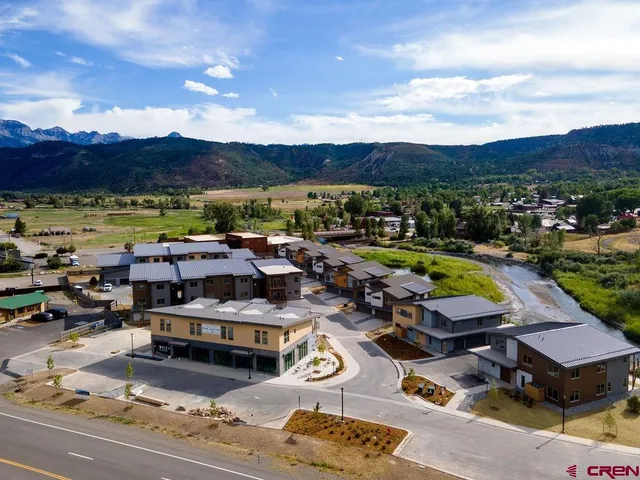 a view of a swimming pool and lounge chairs