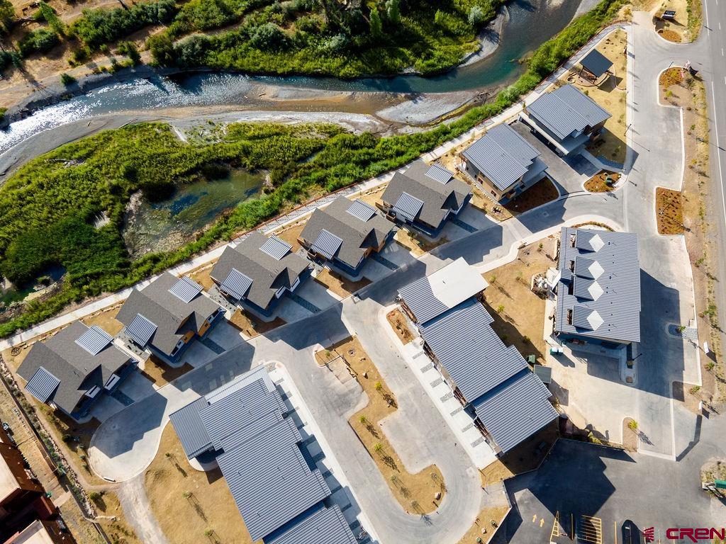 199 Riverfront Lane, Unit 201 Ridgway, CO 81432 - Photo 17 of 22 an aerial view of residential houses with outdoor space