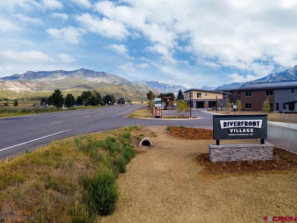 199 Riverfront Lane, Unit 201 Ridgway, CO 81432 - Photo 22 of 22 a street view with residential house and car parked