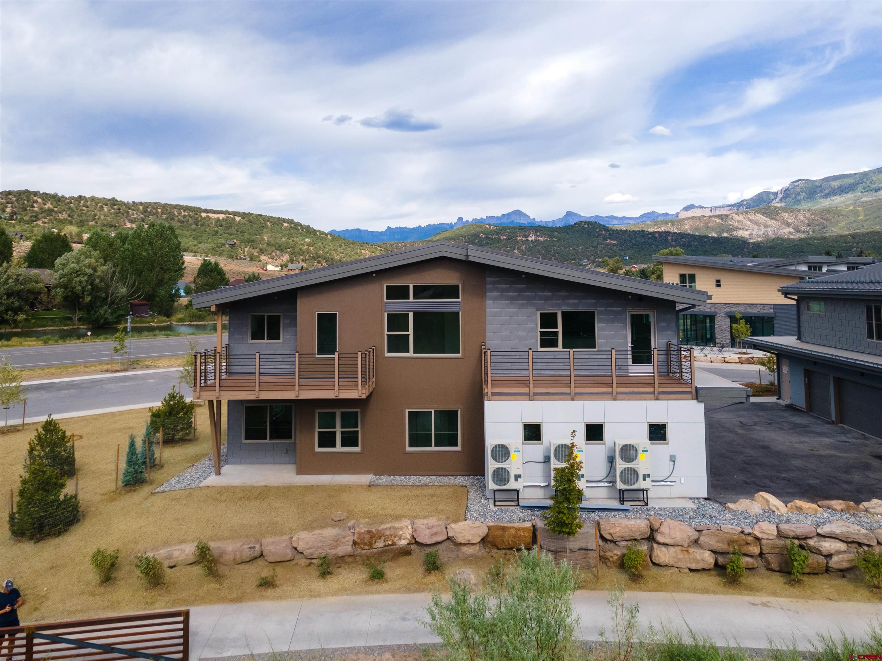 199 Riverfront Lane, Unit 201 Ridgway, CO 81432 - Photo 6 of 22 an aerial view of a house with basket ball court
