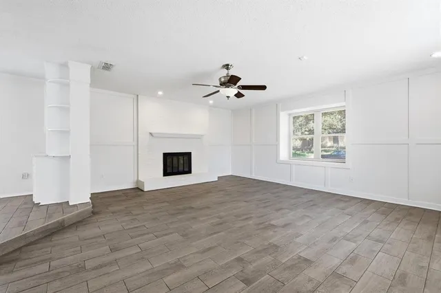 a view of kitchen with cabinets and wooden floor