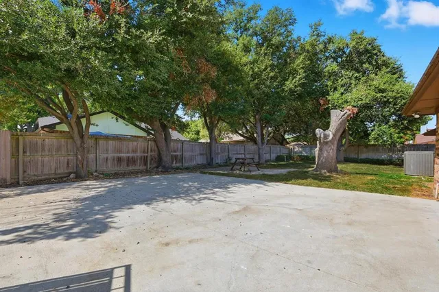 a house that is sitting in middle of the forest