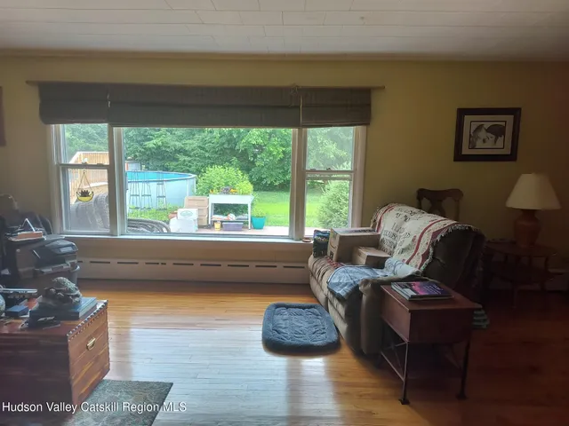 a view of a room that has a large window