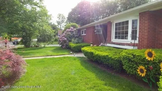 a front view of a house with garden