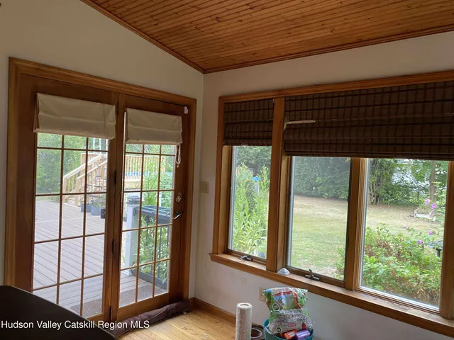a view of outdoor space and deck with patio