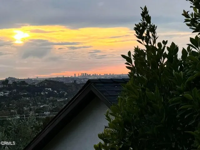 a view of an ocean and a mountain