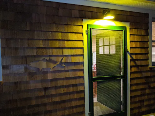 a bathroom with a shower and a sink