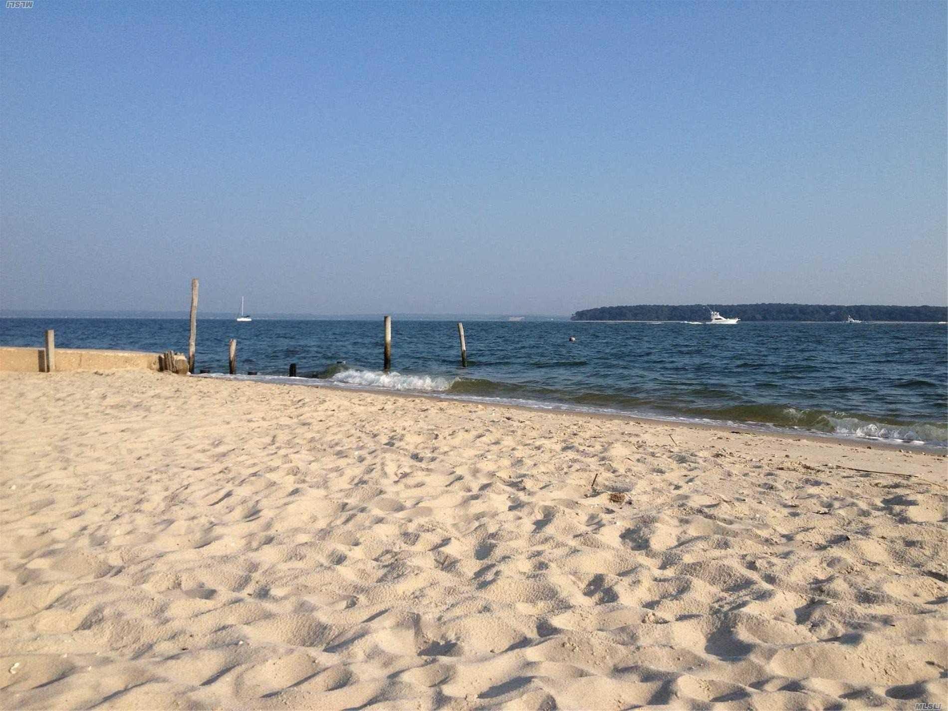 16640 Main Street, Unit COTTAG New Suffolk, NY 11956 - Photo 9 of 11 a view of water covered with snow