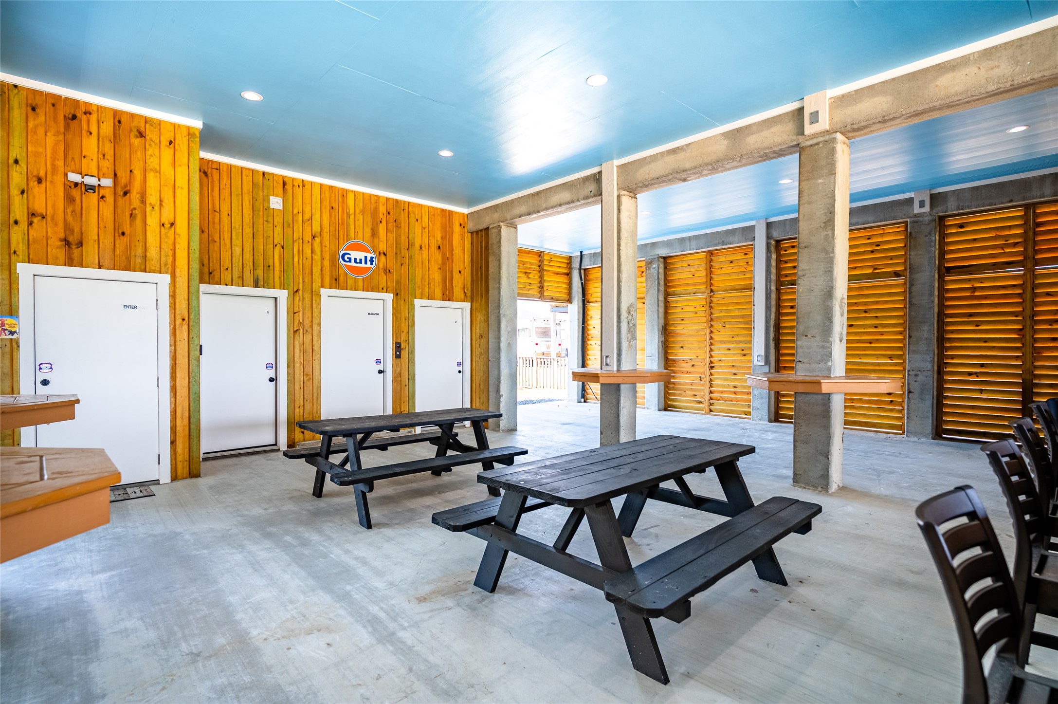 342 Atkinson Street Crystal Beach, TX 77650 - Photo 11 of 50 a living room with furniture and large windows