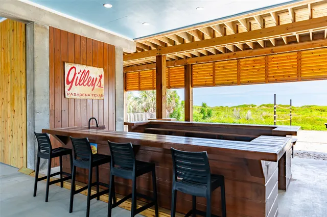 a view of a dining table and chairs in a room