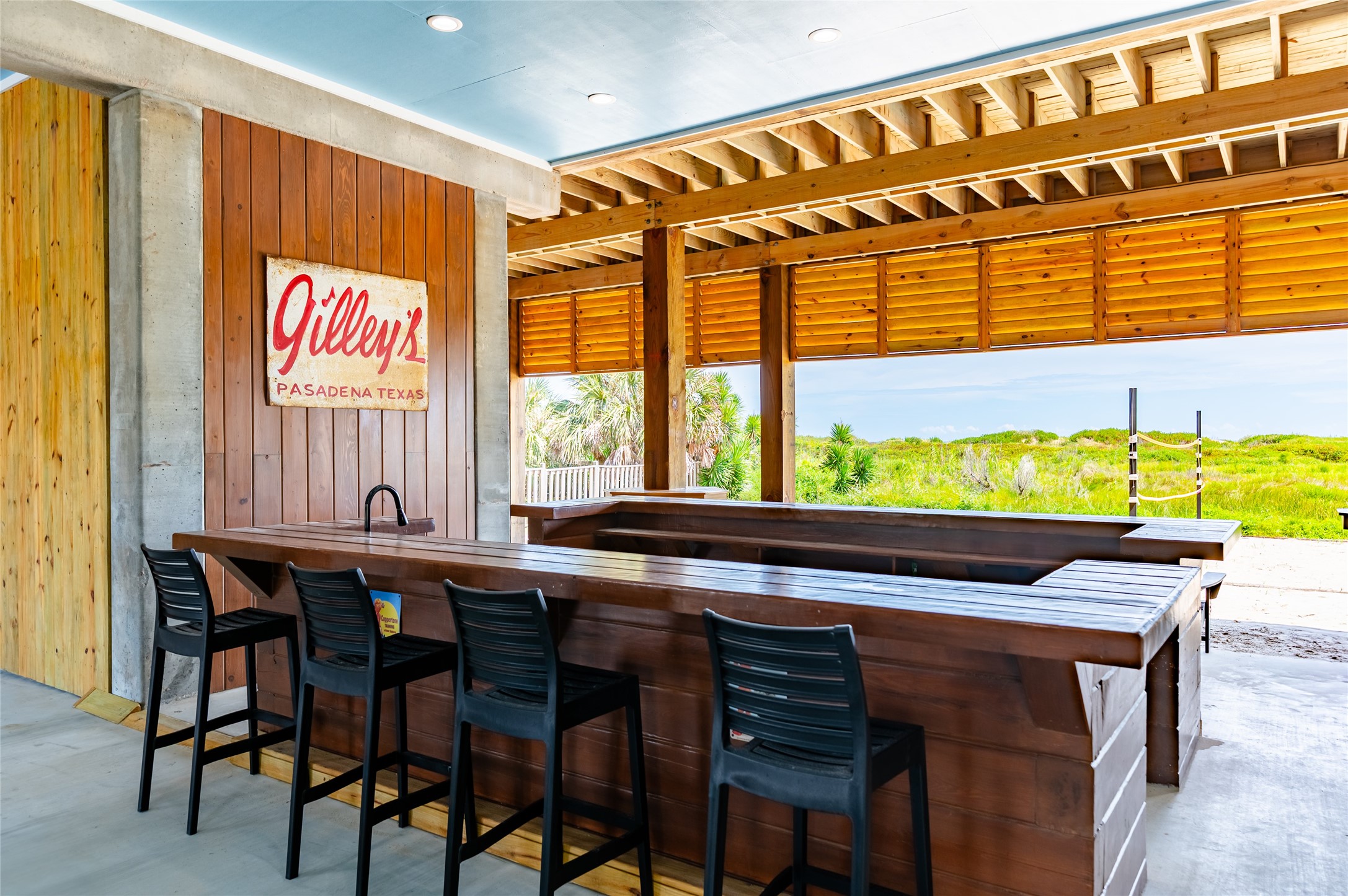 342 Atkinson Street Crystal Beach, TX 77650 - Photo 12 of 50 a view of a dining table and chairs in a room