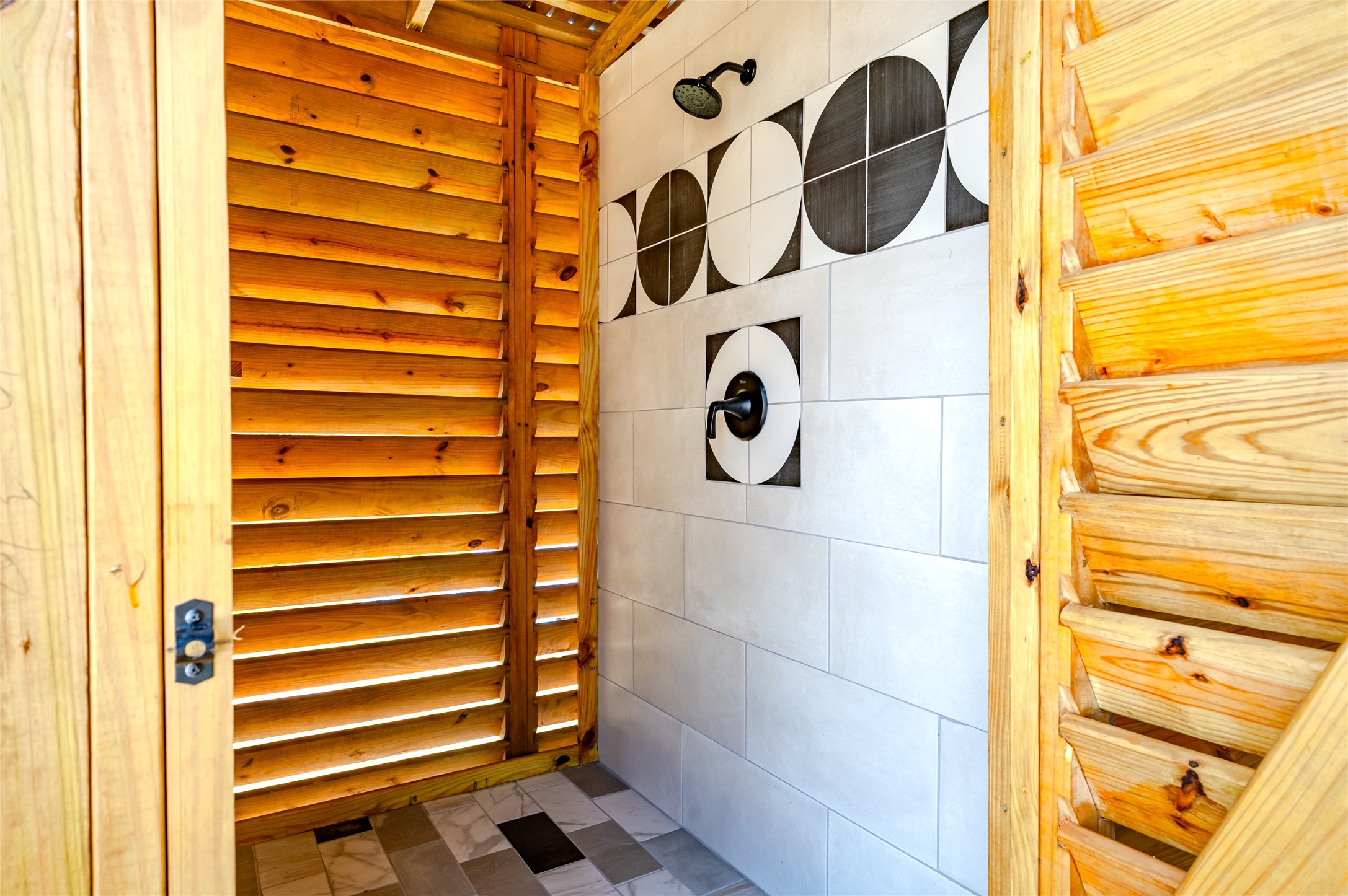 342 Atkinson Street Crystal Beach, TX 77650 - Photo 13 of 50 a bathroom with a mirror and a shower