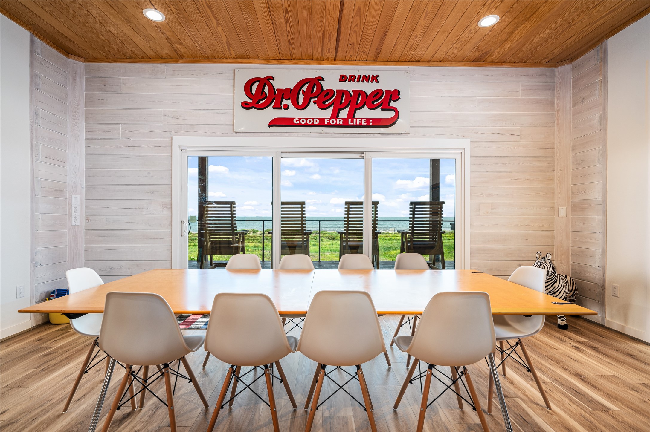 342 Atkinson Street Crystal Beach, TX 77650 - Photo 17 of 50 a view of a dining room with furniture wooden floor and chandelier