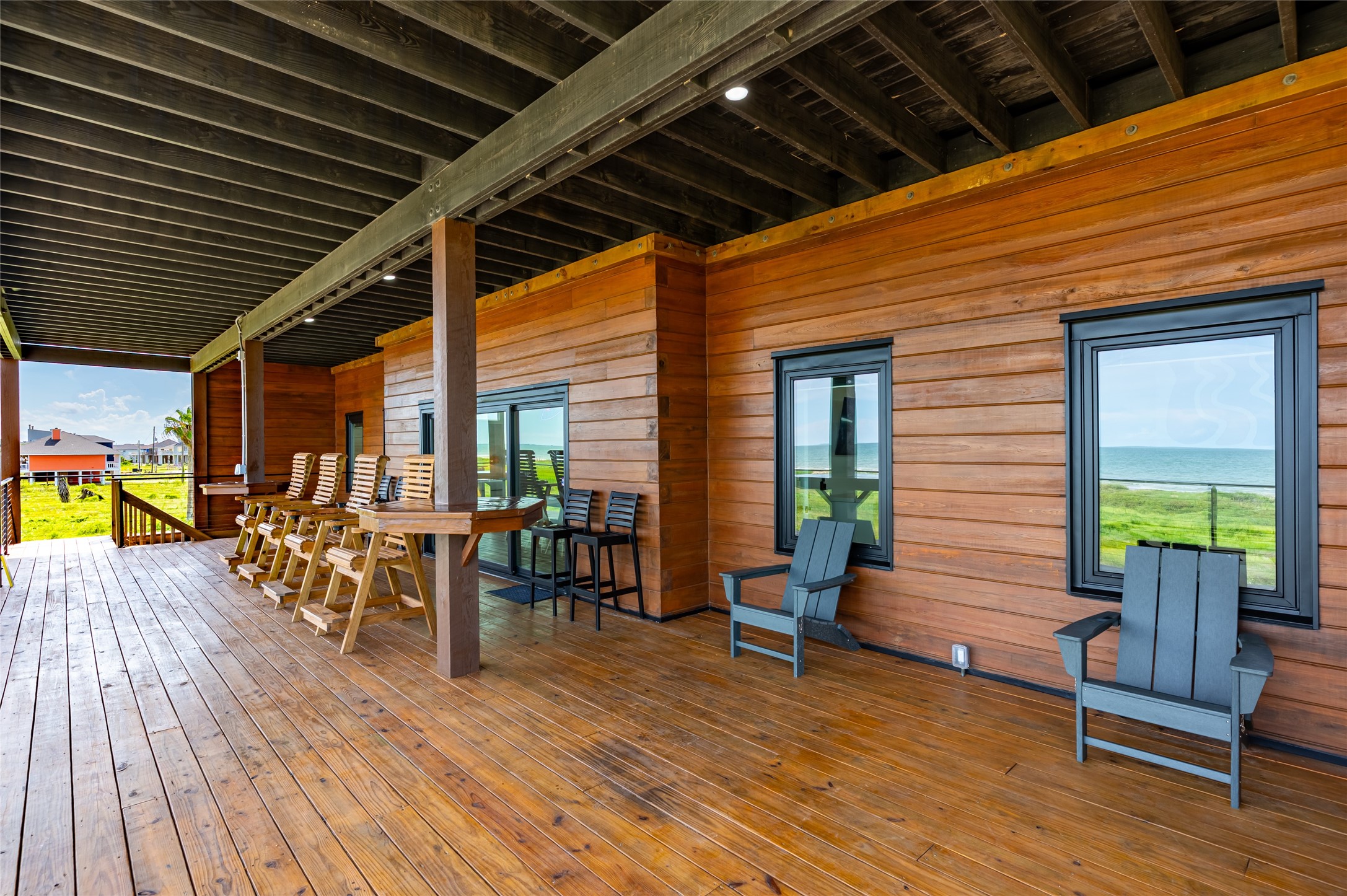 342 Atkinson Street Crystal Beach, TX 77650 - Photo 18 of 50 a view of a porch with wooden floor