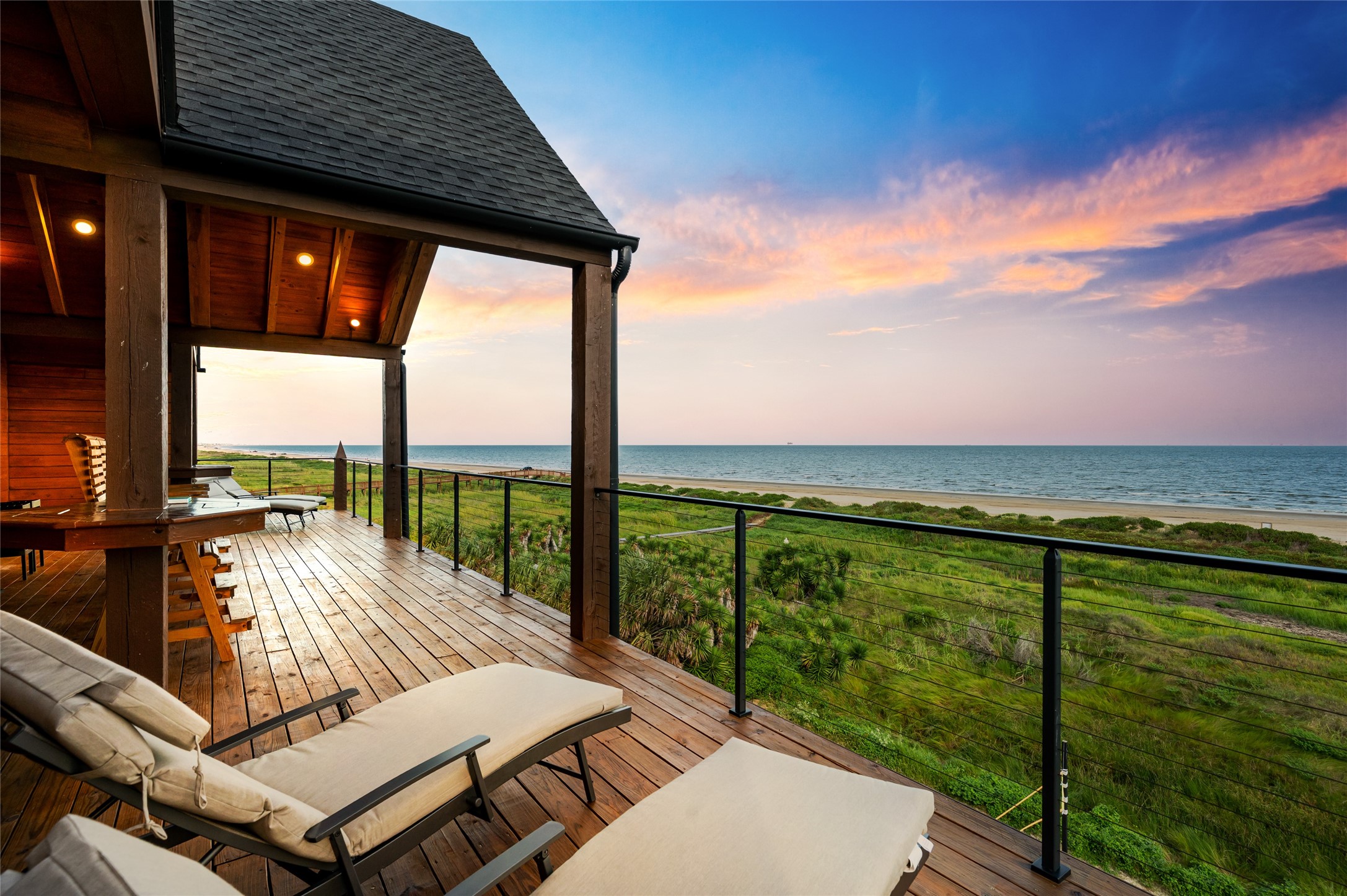 342 Atkinson Street Crystal Beach, TX 77650 - Photo 2 of 50 a view of a balcony with lake view and a ocean view