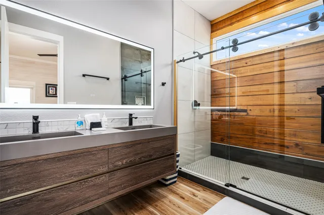 a bathroom with a shower and a sink