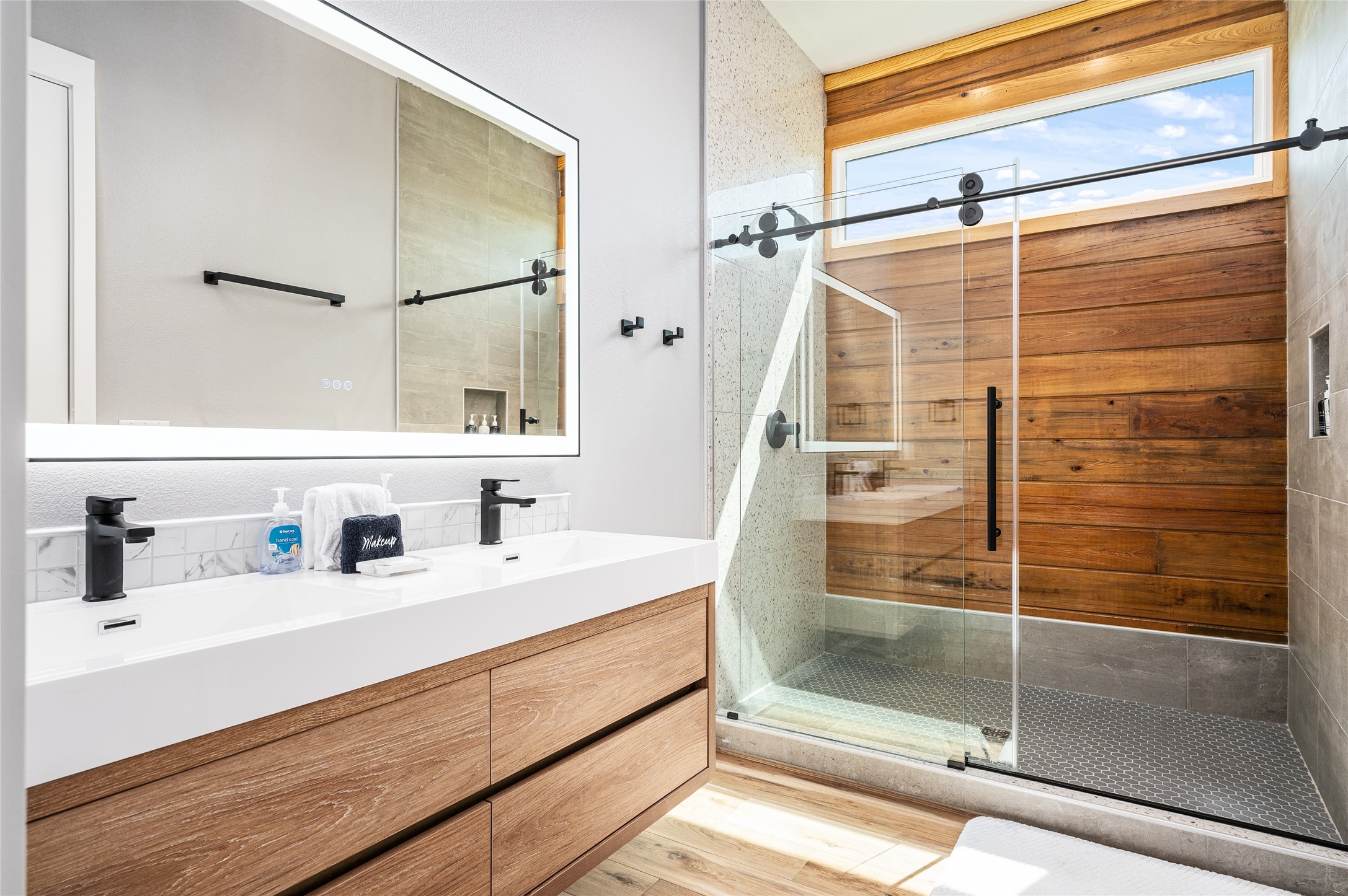 342 Atkinson Street Crystal Beach, TX 77650 - Photo 26 of 50 a bathroom with a shower sink and mirror