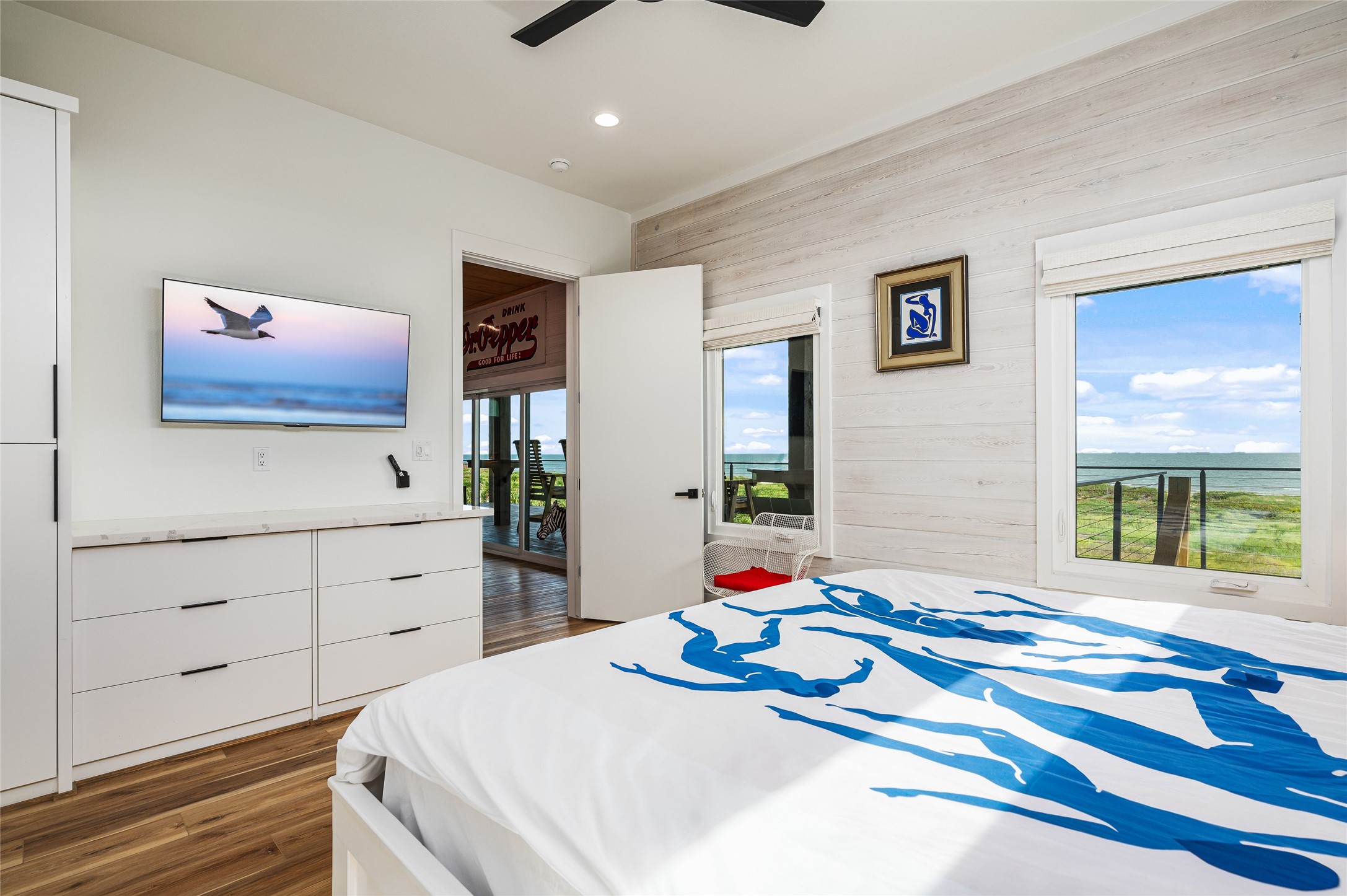 342 Atkinson Street Crystal Beach, TX 77650 - Photo 28 of 50 a bedroom with a bed and a window